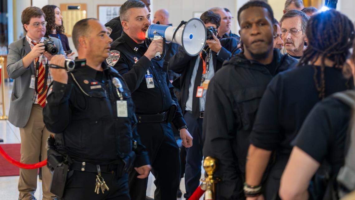 General Assembly police remove demonstrators from the North Carolina Legislative Building after the House voted to override Gov. Roy Cooper’s veto of a Helene relief bill that reduces the power of incoming Democrats in the executive branch during a session on Wednesday, Dec. 11, 2024. Cooper vetoed Senate Bill 382 on Nov. 26, calling it “a sham” and criticizing it for lacking hurricane relief and including various power grabs.