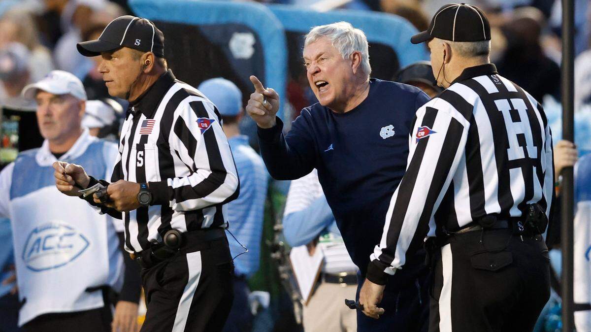 North Carolina head coach Mack Brown has words with the officials during the first half of N.C. State’s game against UNC at Kenan Stadium in Chapel Hill, N.C., Friday, Nov. 25, 2022.