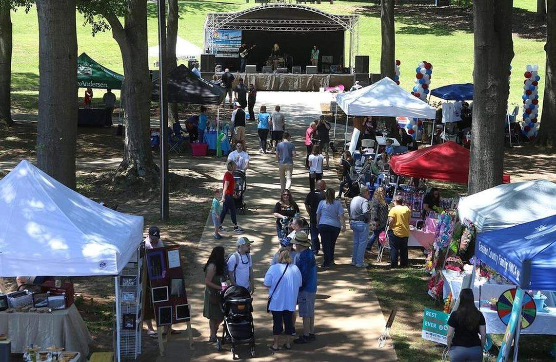The city of Belmont in eastern Gaston County has seen its population increase exponentially in the last 10 to 20 years. Seen here are people frequenting Stowe Park, which fronts Main Avenue in downtown Belmont, during the annual Garibaldi Fest.