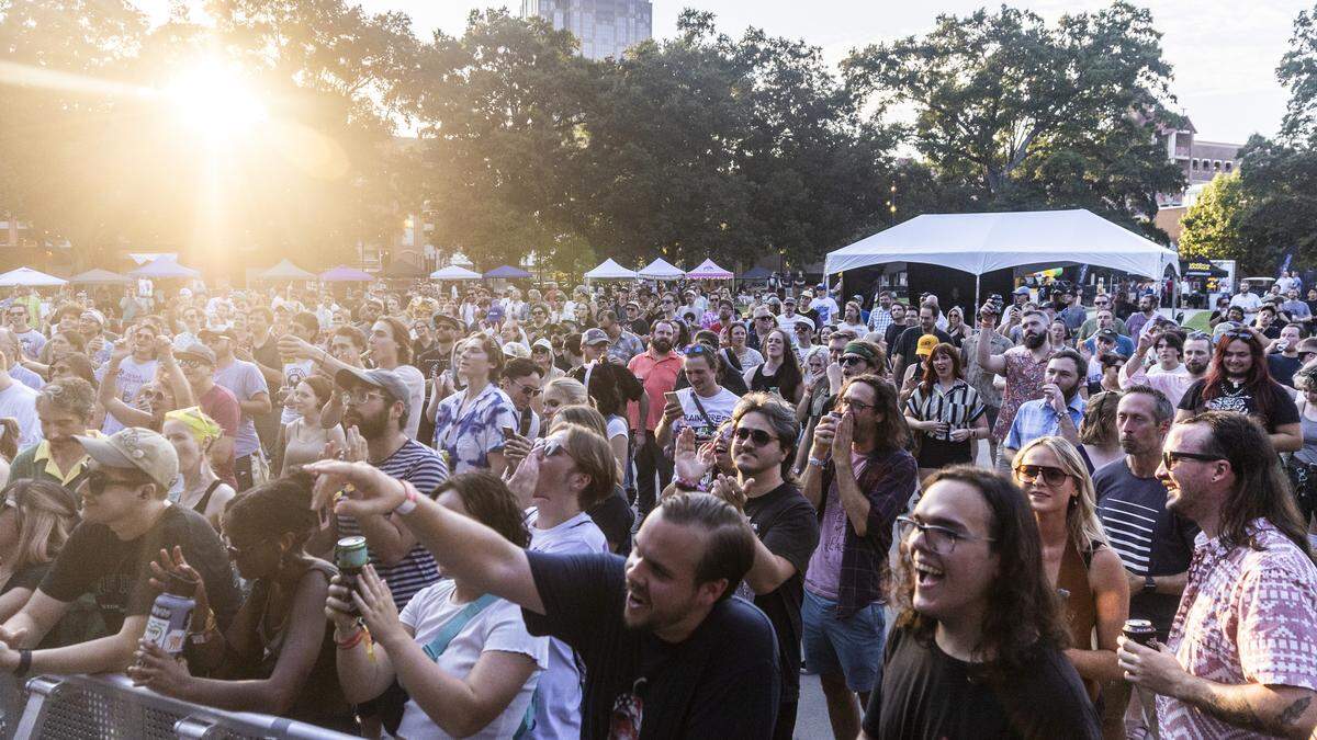 Fans watch Eshu Tune perform Thursday, Sept. 7 2023 at Moore Square in Raleigh during the annual Hopscotch Music Festival.