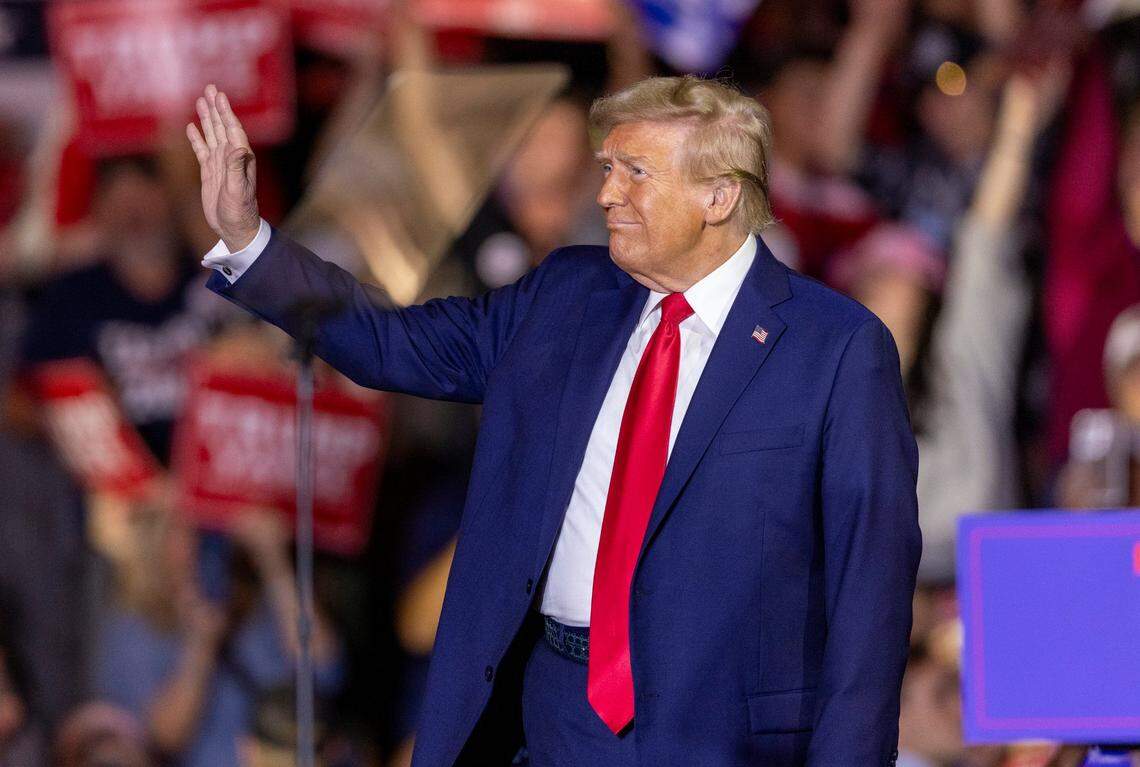 Former President Donald Trump takes the stage during a rally at Minges Coliseum in Greenville on Monday, Oct. 21, 2024. With two weeks until Election Day, Trump went on a three-city tour, in which Trump will also see the destruction caused by Hurricane Helene in Asheville and speak at a faith conference in Concord.