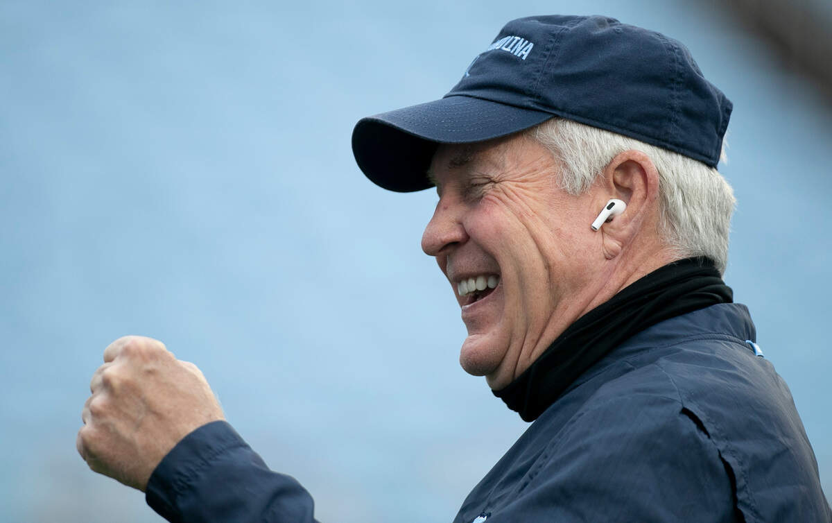 North Carolina head coach Mack Brown laughs with the television crew as he prepares to do an interview prior to the Tar Heels’ game against Virginia Tech on Saturday, October 10, 2020 at Kenan Stadium in Chapel Hill, N.C.