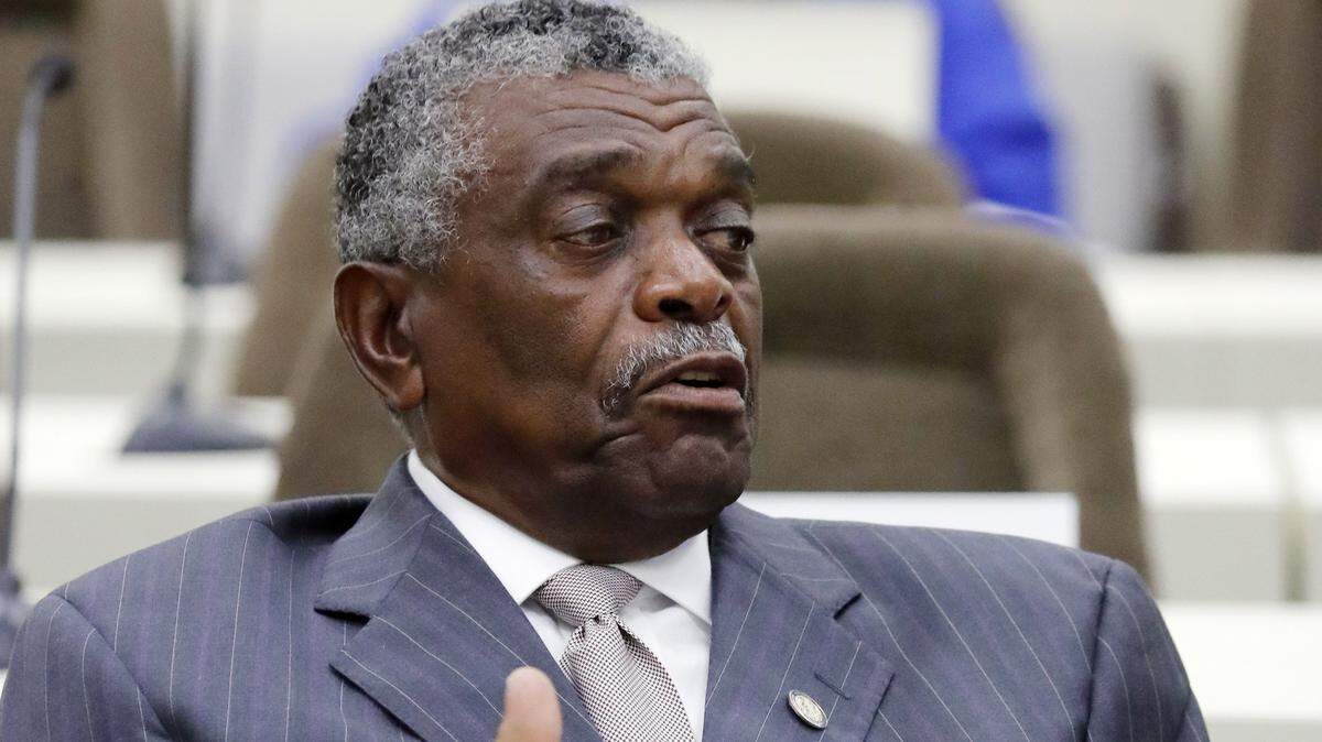 NC House Rep. Elmer Floyd (D-Cumberland) talks with another member before a House Rules Committee meeting held at the Legislative Office Building in Raleigh on June 14, 2018.