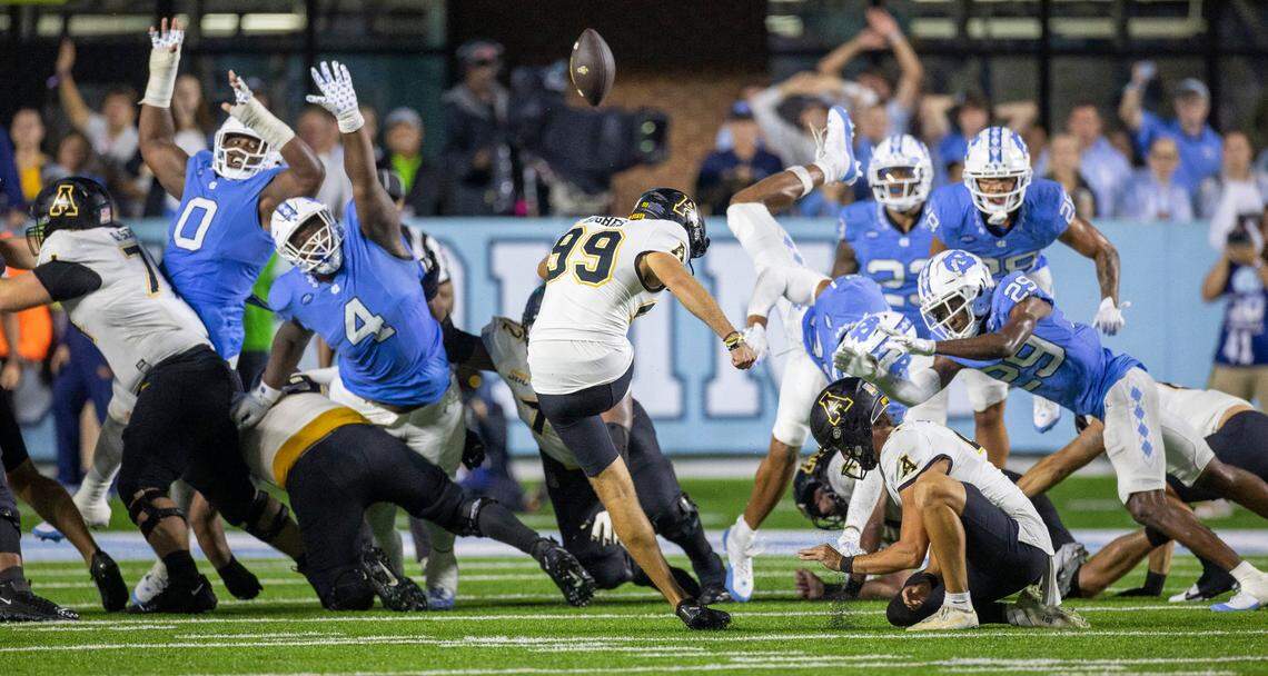 Appalachian State’s Michael Hughes (99) boots an extra point attempt to tie North Carolina 27-27, with 1:22 to play in the game on Saturday September 9, 2023 at Kenan Stadium in Chapel Hill, N.C.