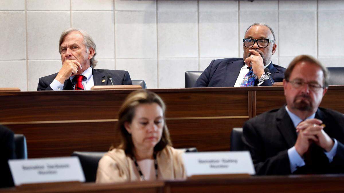 Sen. Bill Rabon, left, and Sen. Paul Lowe, Jr., listen during a Senate Judiciary hearing about Senate Bill 711, the N.C. Compassionate Care Act, at the Legislative Building in Raleigh, N.C., Wednesday, June 30, 2021.