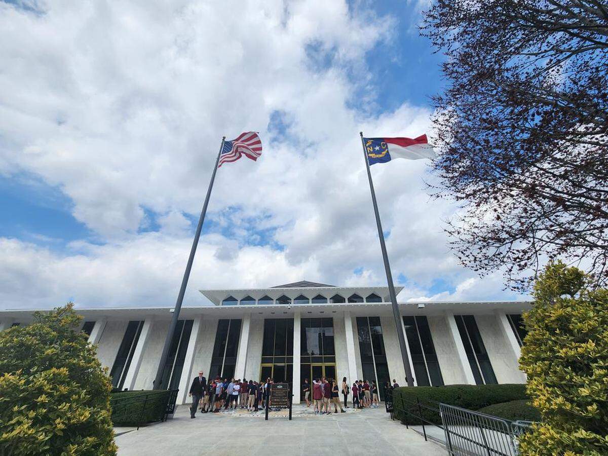 The North Carolina Legislative Building on Jones Street in downtown Raleigh, N.C., where the General Assembly meets, is pictured on Feb. 23, 2023, with several students on field trips gathered out front.