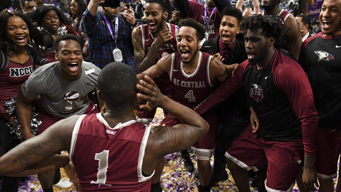 North Carolina Central point guard Jordan Perkins (4) and his teammates celebrate after defeating Hampton 71-63 to win the Mid-Eastern Athletic Conference tournament, Saturday, March 10, 2018, in Norfolk, Va.