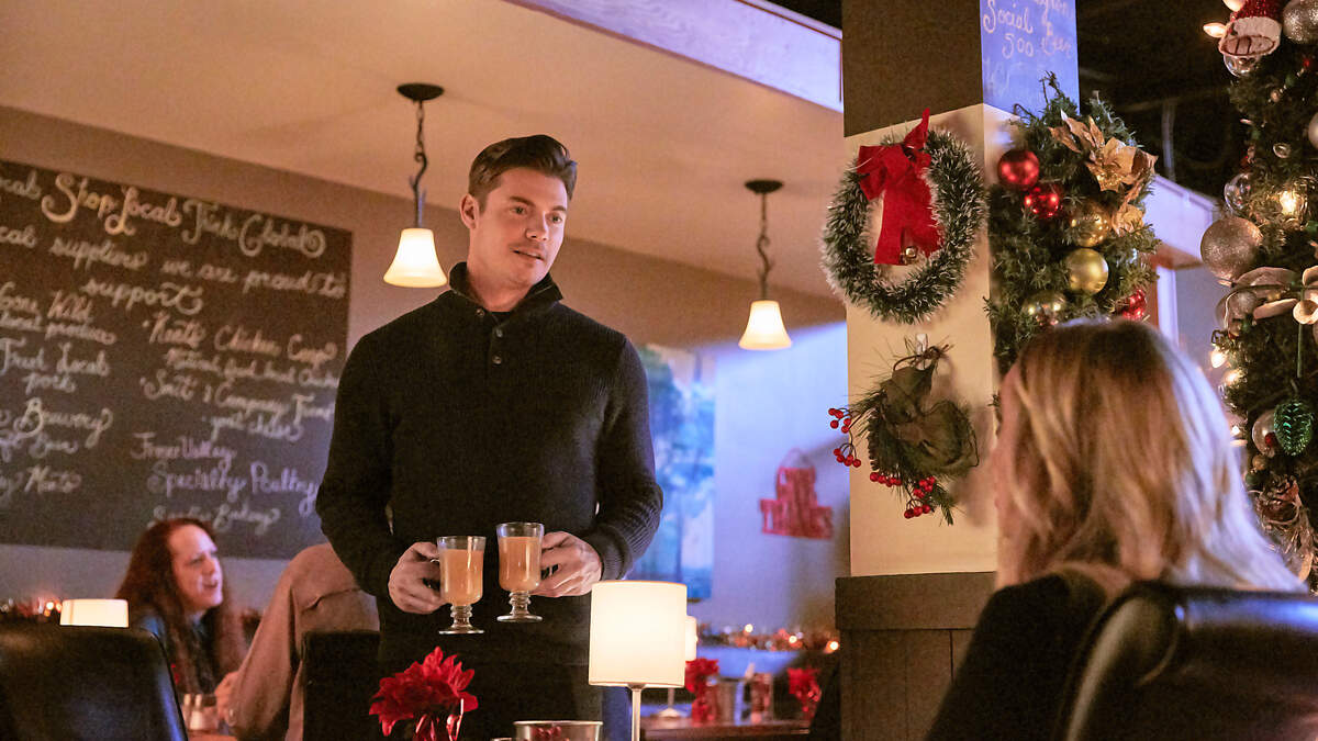 Cara faces a bittersweet Christmas since her mothers passing. Flying to Oklahoma, she meets country singer Heath, facing a tough holiday too since his fathers death. He doesnt acknowledge his fame, so Cara feels duped when two attractive women rush him. As weather keeps thwarting their way, Cara and Heath share their losses, and as they head toward their separate Christmases, they grow close. But when Cara sees a tabloid linking Heath with a model, and he unwittingly offends her dad by offering financial help, it looks like it might take a Christmas miracle for this couple to find harmony.  Photo: Josh Henderson  Credit: ©2018 Crown Media United States LLC/Photographer: Ryan Plummer