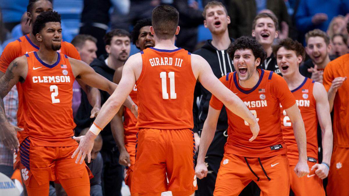 Clemson’s Joseph Girard III (11) is welcomed to the bench as they celebrate their 80-76 victory over North Carolina on Tuesday, February 6, 2024 at the Dean E. Smith Center in Chapel Hill, N.C. Girard scored 21 points in the victory.