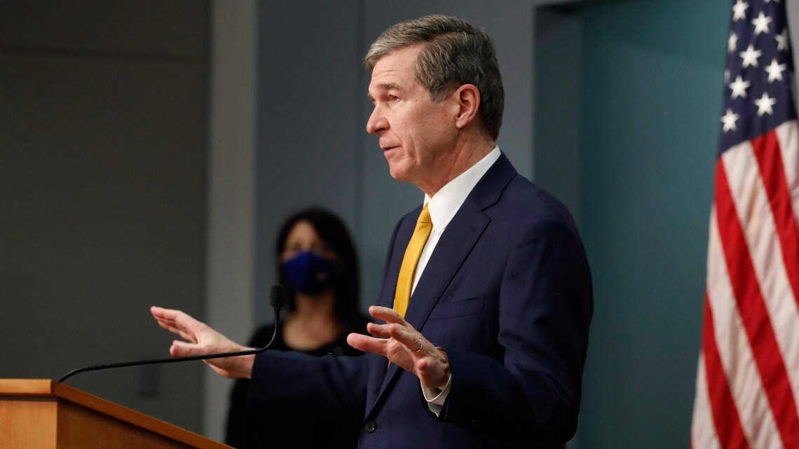 NC governor extends statewide curfew, urges staying home as COVID vaccinations underway