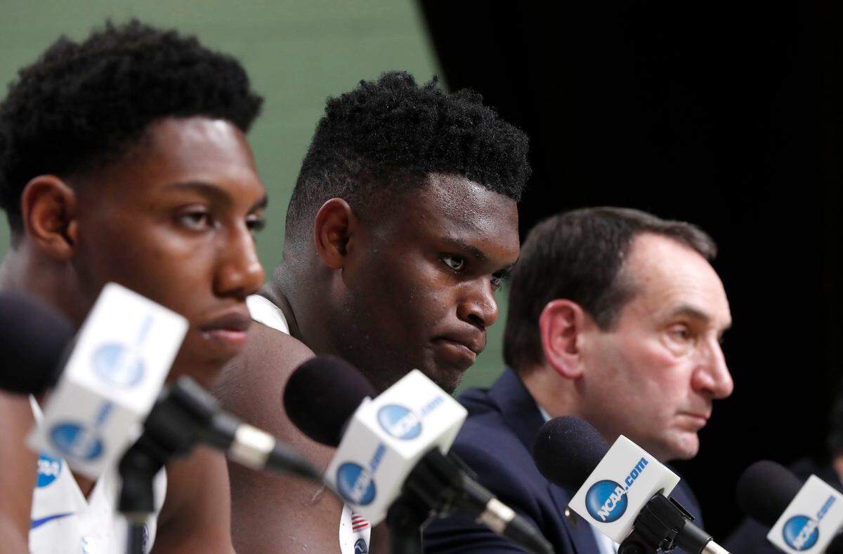 Duke’s RJ Barrett, left, Zion Williamson and head coach Mike Krzyzewski listen to a question after Michigan State’s 68-67 victory over Duke in their NCAA Elite 8 game in Washington, D.C., Sunday, March 31, 2019.