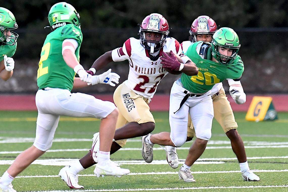 Mallard Creek running back Joshua Person (22) runs for yardage off the kickoff return against the Cardinal Gibbons defense during the first half.  The Mallard Creek Mavericks and the Cardinal Gibbons Crusaders met in a non-conference football game in Raleigh, N.C. September 19, 2025