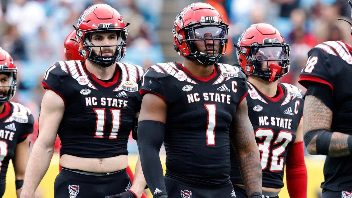 N.C. State linebackers Payton Wilson (11), Isaiah Moore (1) and Drake Thomas (32) line up during the second half of Maryland’s 16-12 victory over N.C. State in the Duke’s Mayo Bowl at Bank of America Stadium in Charlotte, N.C., Friday, Dec. 30, 2022.