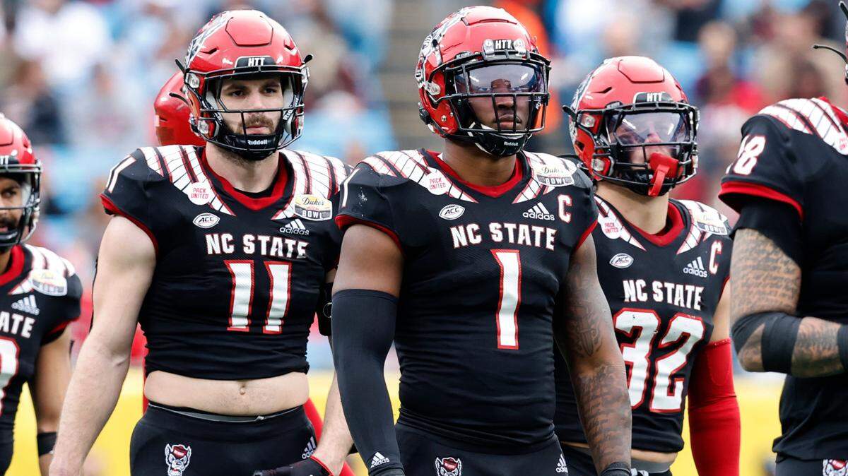 N.C. State linebackers Payton Wilson (11), Isaiah Moore (1) and Drake Thomas (32) line up during the second half of Maryland’s 16-12 victory over N.C. State in the Duke’s Mayo Bowl at Bank of America Stadium in Charlotte, N.C., Friday, Dec. 30, 2022.