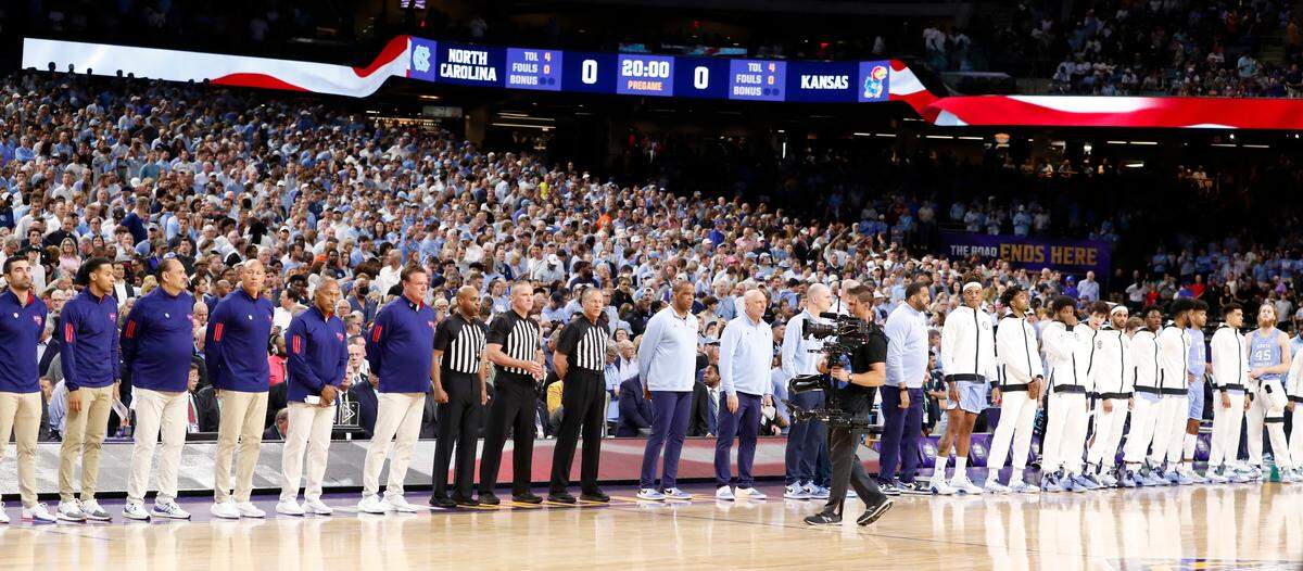 Kansas and North Carolina line up for the national anthem before UNC’s game against Kansas in the NCAA Men’s National Championship at the Caesars Superdome in New Orleans, La., Monday, April 4, 2022.