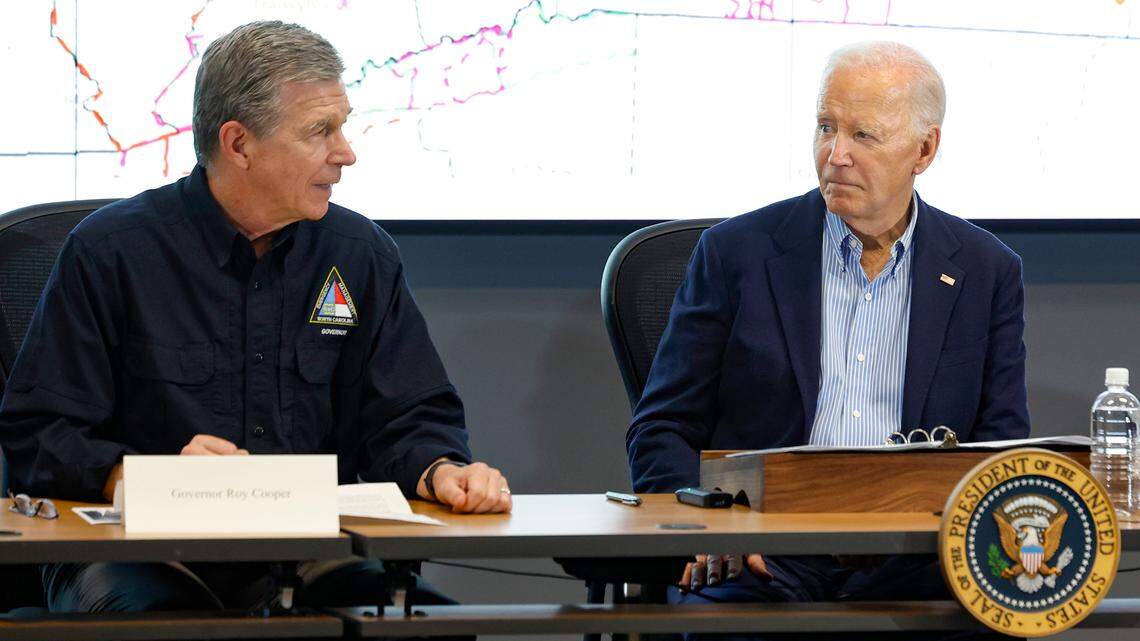 President Joe Biden listens to N.C. Gov. Roy Cooper as gets a briefing on the response to Hurricane Helene at the N.C. Emergency Operations Center in Raleigh, N.C., Wednesday, Oct. 2, 2024.