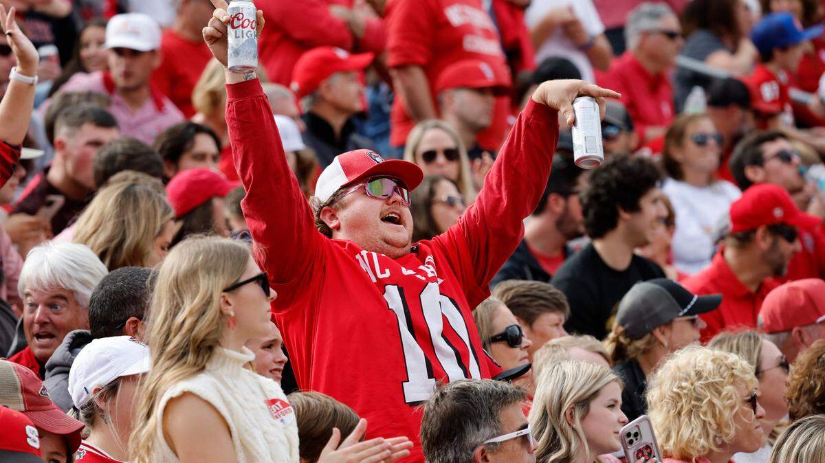 A Wolfpack fan cheers after a touchdown during the second half of N.C. State’s 59-28 victory over Stanford at Carter-Finley Stadium in Raleigh, N.C., Saturday, Nov. 2, 2024.