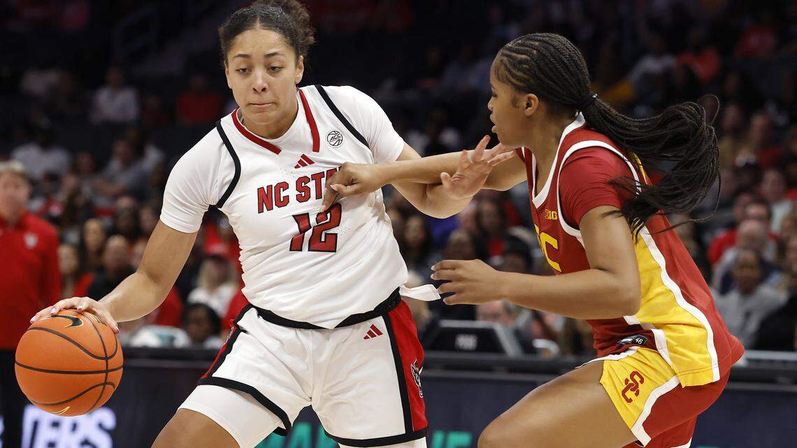 N.C. State’s Khamil Pierre handles the ball against Southern California’s Kara Dunn during the first half of the Wolfpack’s 69-68 loss in the Ally Tipoff game on Sunday, Nov. 9, 2025, at Spectrum Center in Charlotte, N.C.