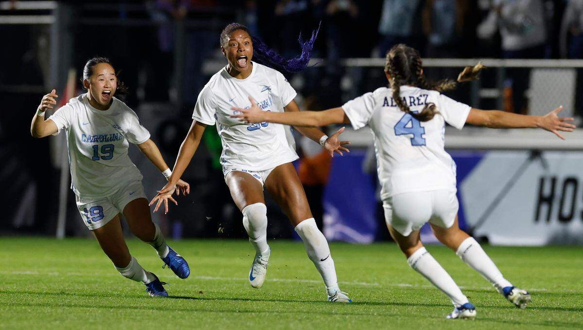 North Carolina’s Olivia Thomas (33) celebrates scoring in the second half of UNC’s 1-0 victory over Wake Forest in the finals of the 2024 Women’s College Cup at WakeMed Soccer Park in Cary, N.C., Monday, Dec. 9, 2024. With her are North Carolina’s Aria Nagai (19) and Aven Alvarez (4)