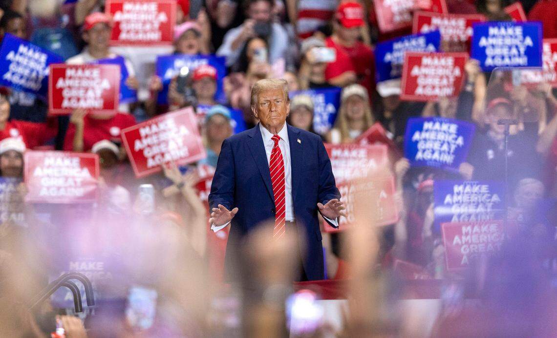 Former President Donald Trump, the Republican presidential nominee, soaks up applause from his supporters as he arrives for a rally on Wednesday, October 30, 2024 at the Rocky Mount Event Center in Rocky Mount, N.C.