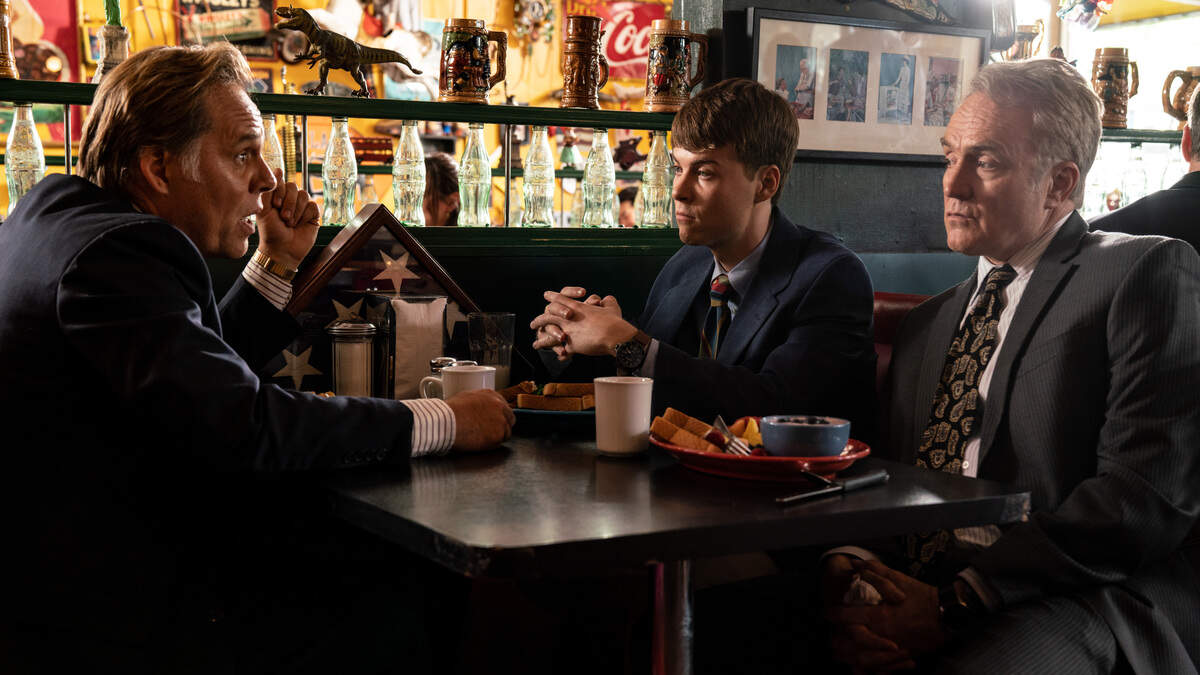 (Left to right) Matthew Harrison as an AOL executive meeting with John Karna as Marc Andreessen and Bradley Whitford as James Barksdale in Buck’s of Woodside in National Geographic’s VALLEY OF THE BOOM. (National Geographic/Ed Araquel)