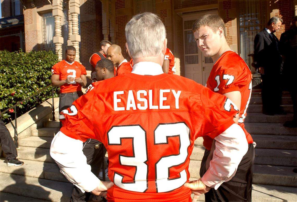 Governor Mike Easley mingles with N.C. State football players including Philip Rivers, right, on the steps of the Executive Mansion in Raleigh after congratulating the team and proclaiming Saturday, January 11, 2003, “Wolfpack Day.”