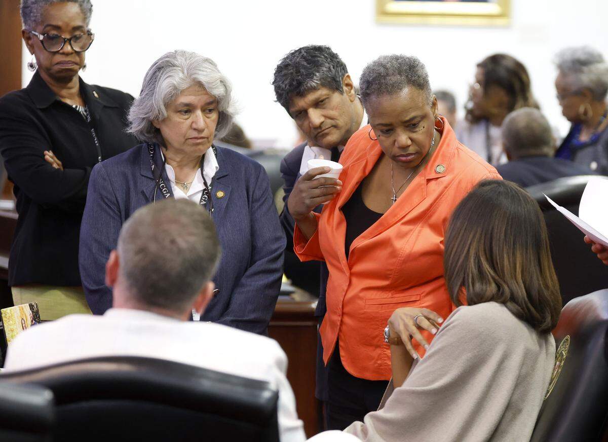North Carolina Senate Minority Leader Sydney Batch, right, talks with fellow senators including from left Val Applewhite, Lisa Grafstein, Jay Chaudhuri and Kandie Smith during a break in the N.C. Senate session at the Legislative Building in Raleigh, N.C., Tuesday, May 19, 2026.