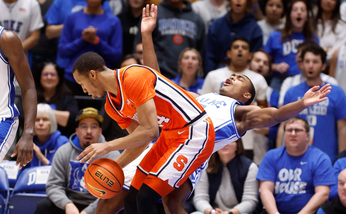 Syracuse’s Quadir Copeland (24) is called for the foul on Duke’s Jaylen Blakes (2) during the first half of Duke’s game against Syracuse at Cameron Indoor Stadium in Durham, N.C., Tuesday, Jan. 2, 2024.