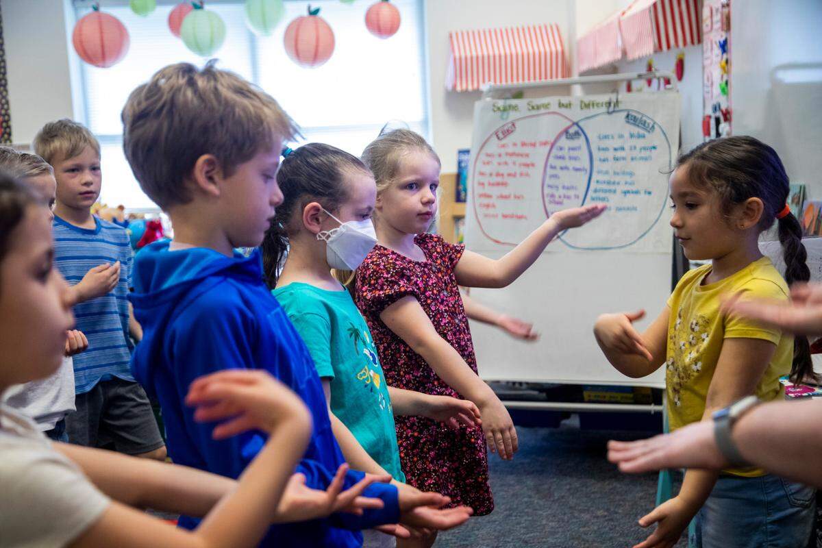 Most students in Holly Berk’s kindergarten class elected not to wear masks Monday, March 7, 2022 at Scotts Ridge Elementary in Apex. Monday marked the first day that face masks are now optional in Wake County schools.