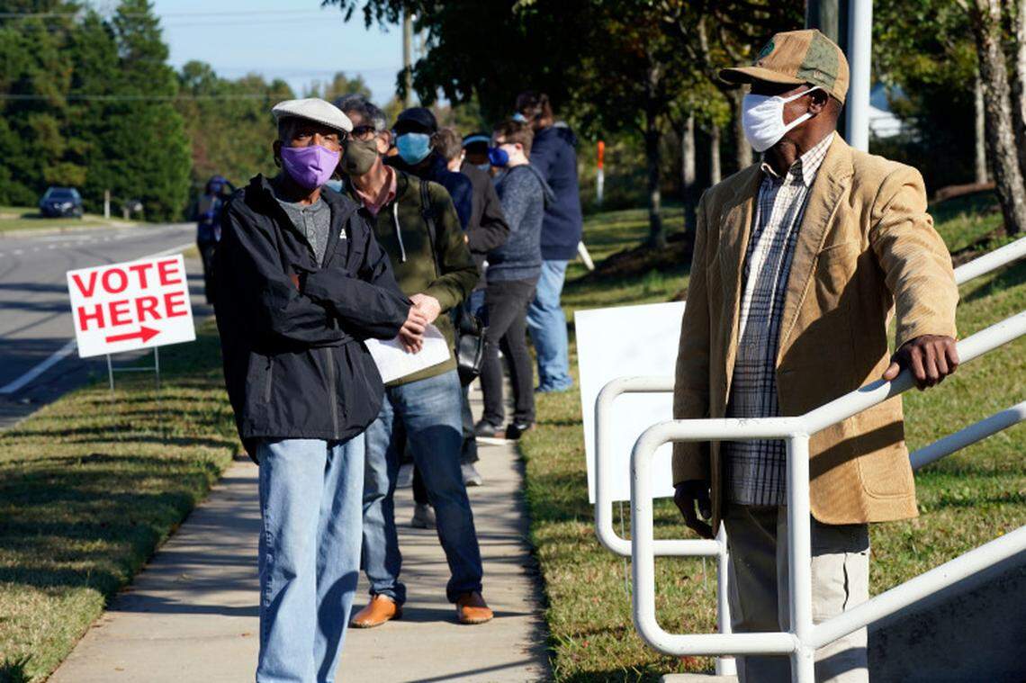 Durham County voters wait to cast their ballots at the South Regional Library polling location in Durham in October 2020.