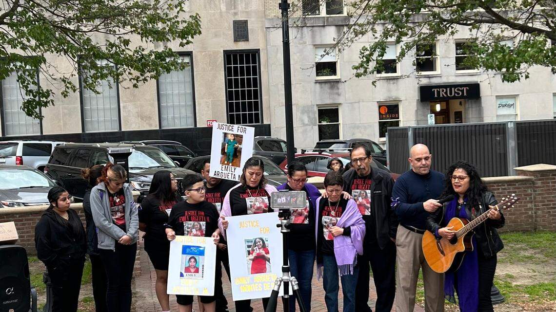 The family of Emily Argueta Montes de Oca, 22, who was shot fatally in Durham on April 7, 2022, stands at a vigil in CCB Plaza to honor gun violence victims on March 28, 2023.