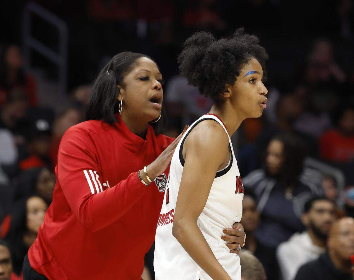 N.C. State Associate Head Coach Nikki West speaks with Qadence Samuels during the second half of the Wolfpack’s game against Southern California on Sunday, Nov. 9, 2025, at Spectrum Center in Charlotte, North Carolina.