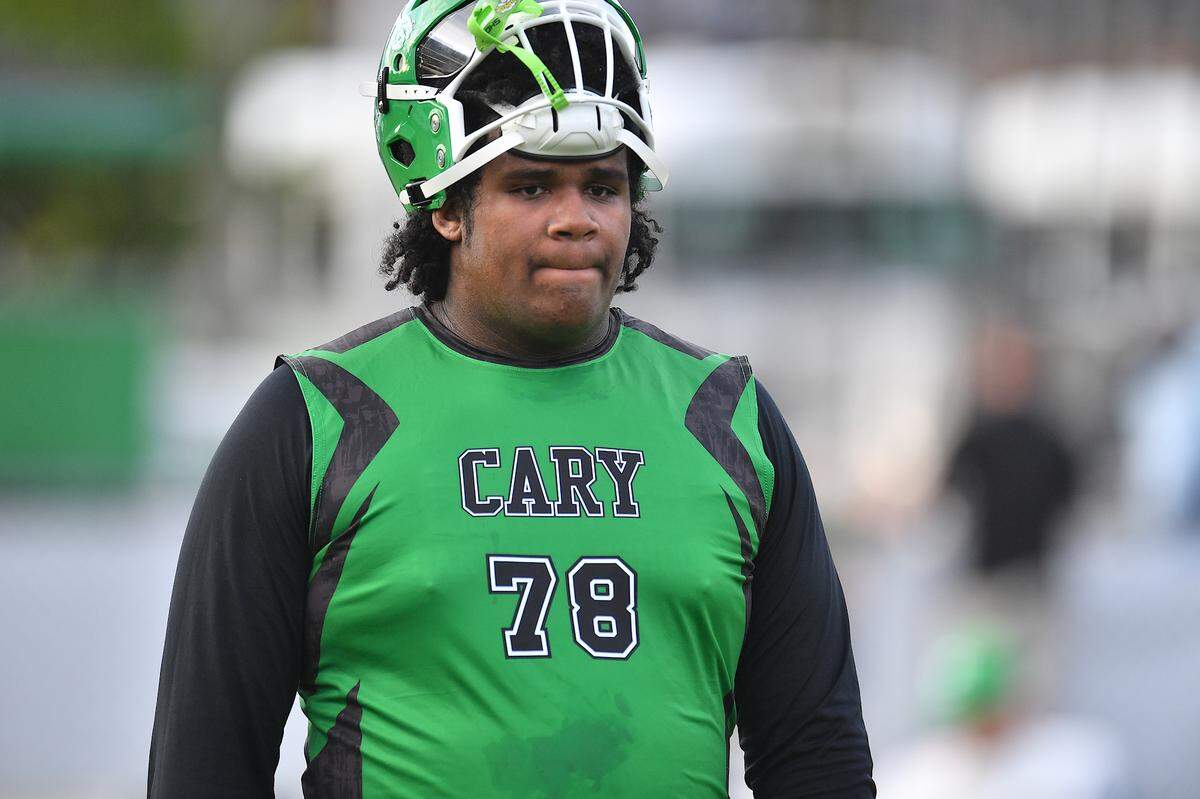 Cary’s Trey Blue (78) between pre-game drills before the game with Athens Drive. The Cary Imps and the Athens Drive Jaguars met in a football game in Cary, N.C. on September 6, 2024. Athens Drive wins 28-13.