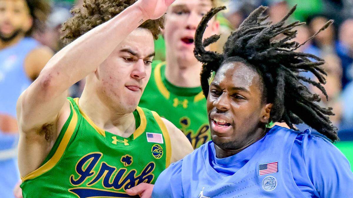 North Carolina Tar Heels gaurd Ian Jackson (11) dribbles as Notre Dame Fighting Irish guard Braeden Shrewsberry (11) defends in the second half at the Purcell Pavilion.