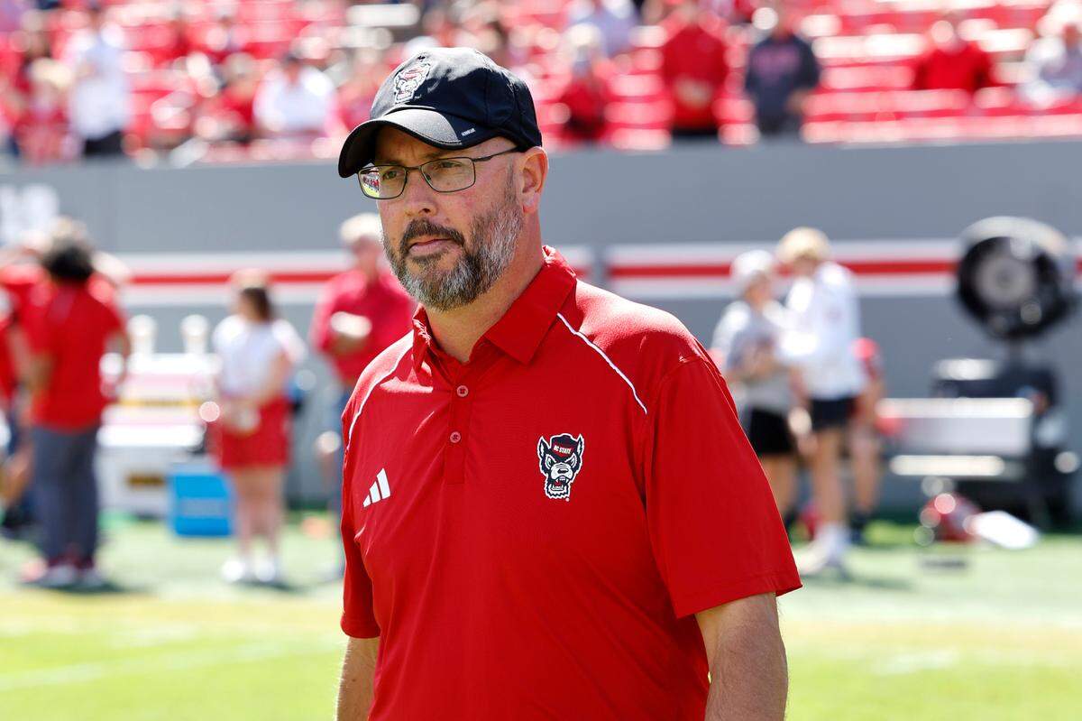 N.C. State quarterbacks coach Kurt Roper walks the field during warmups before the Wolfpack’s game against Marshall at Carter-Finley Stadium in Raleigh, N.C., Saturday, Oct. 7, 2023.