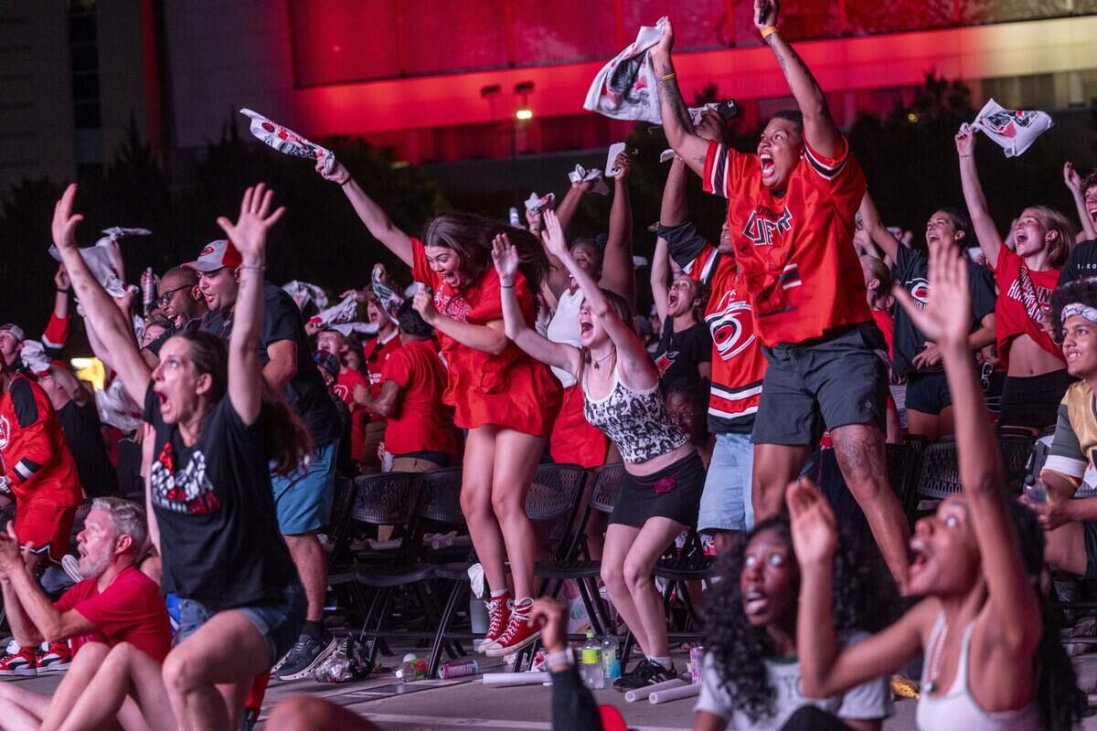 Carolina Hurricanes fans react during a Stanley Cup Final watch party at Red Hat Amphitheater in Raleigh on Thursday, June 11, 2026, as the Hurricanes played the Vegas Golden Knights in Game 5 of the Stanley Cup Final.