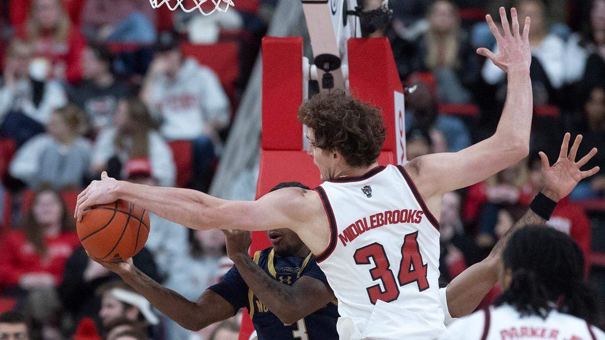 N.C. State’s Ben Middlebrooks pressures Notre Dame’s Markus Burton during the second half of the Wolfpack’s 66-65 win on Wednesday, Jan. 8, 2025, at Lenovo Center in Raleigh, N.C.