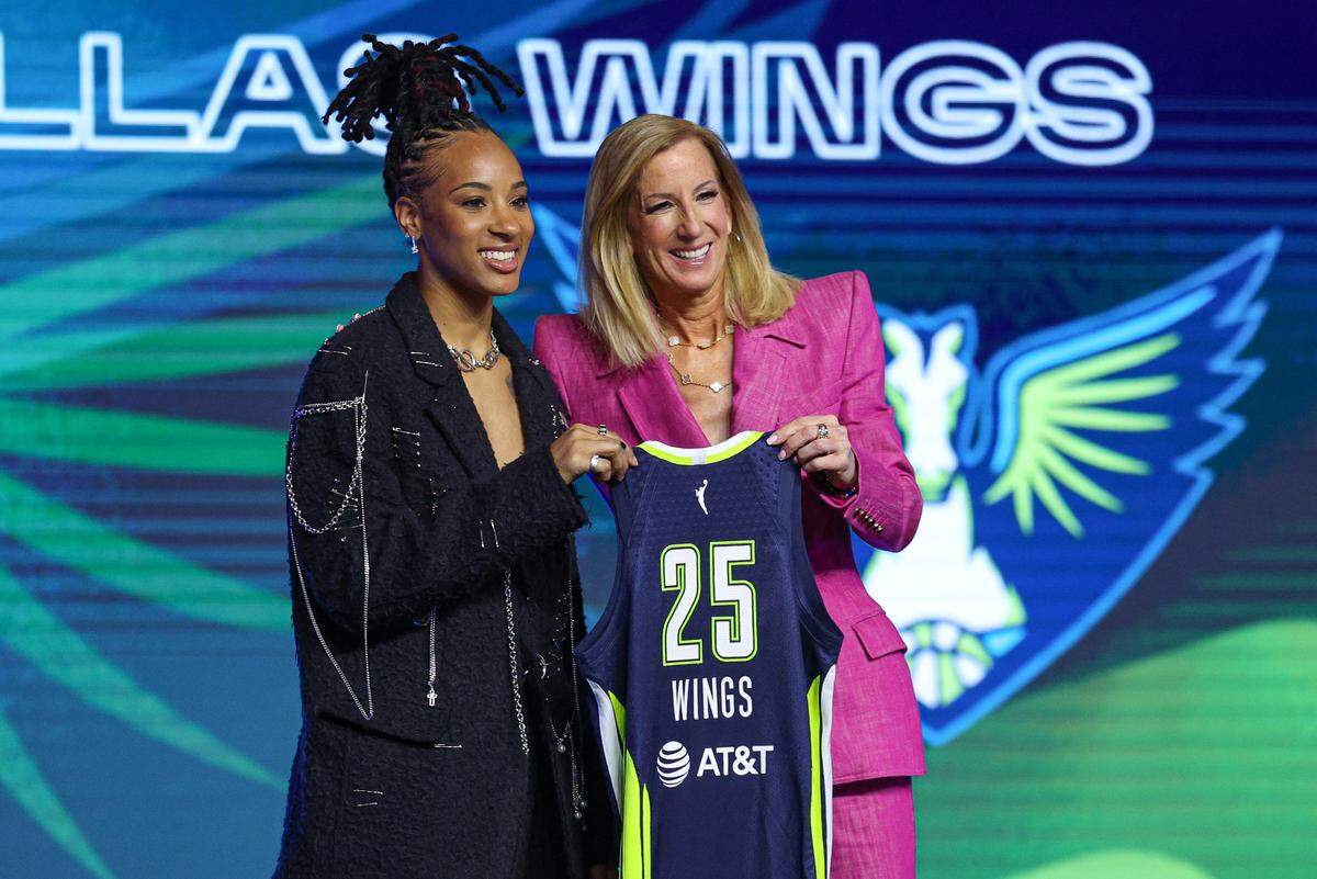 Aziaha James poses with WNBA commissioner Cathy Engelbert after being selected with the number twelve overall pick to the Dallas Wings in the 2025 WNBA Draft at The Shed at Hudson Yards.