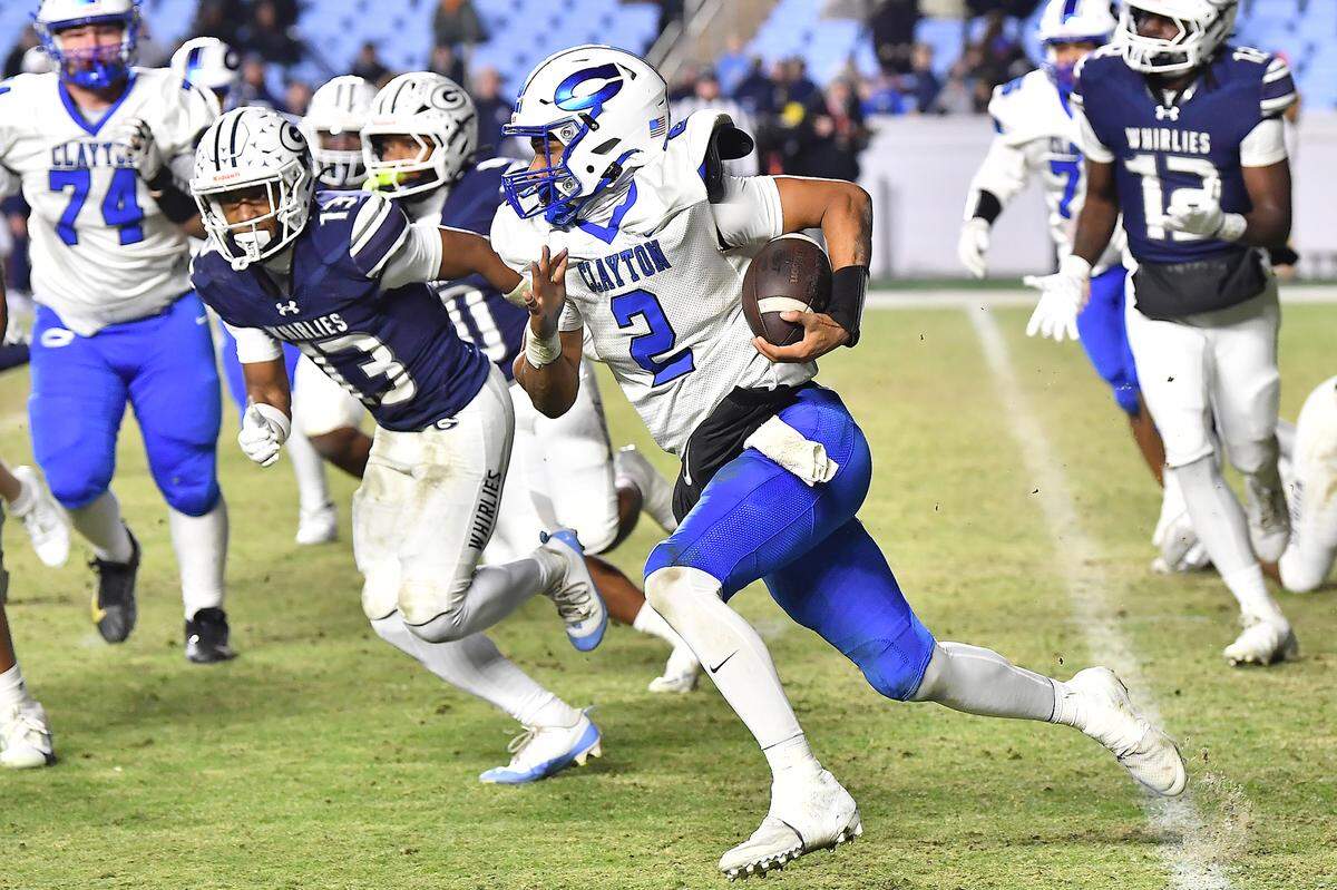 Clayton quarterback Aiden Smalls (2) rusher for yards against Grimsley during the first half.  The Clayton Comets and the Grimsley Whirlies met in the NCHSAA 7A football Championships in Chapel Hill, NC on December 12, 2025.