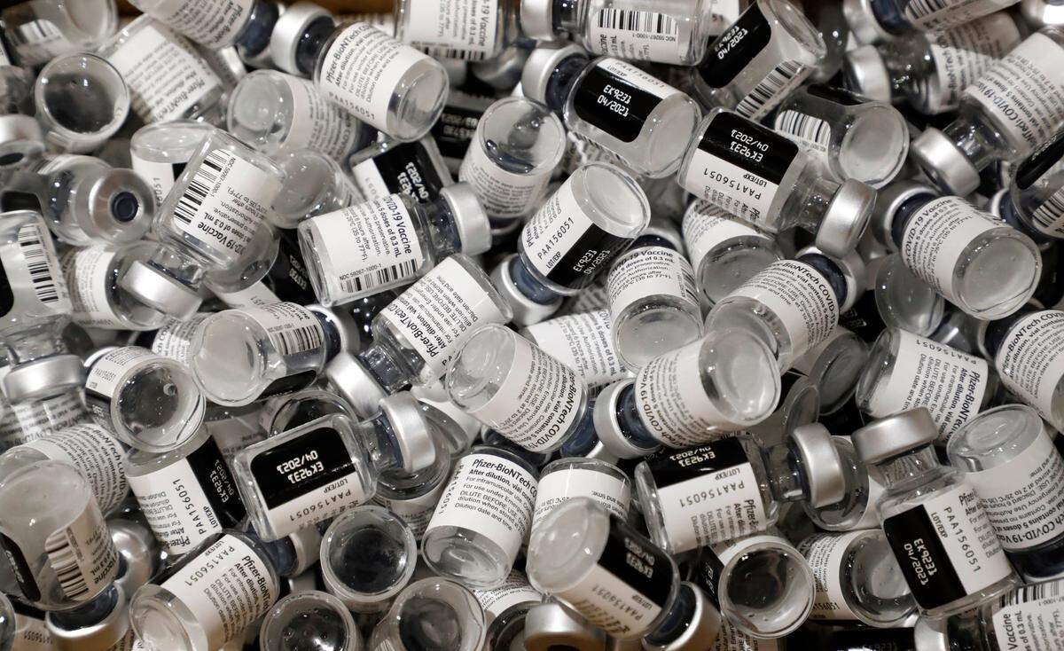 A box holds empty vials of Pfizers COVID-19 vaccine during a COVID vaccine clinic for employees at UNC REX Healthcare at UNC Rex Hospital in Raleigh, N.C., Thursday, January 7, 2021.