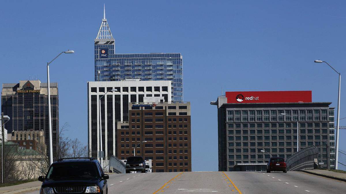 The Red Hat sign is prominent on the Raleigh skyline when you approach from S. Wilmington St., and it too will change if the company's Shadowman logo changes.