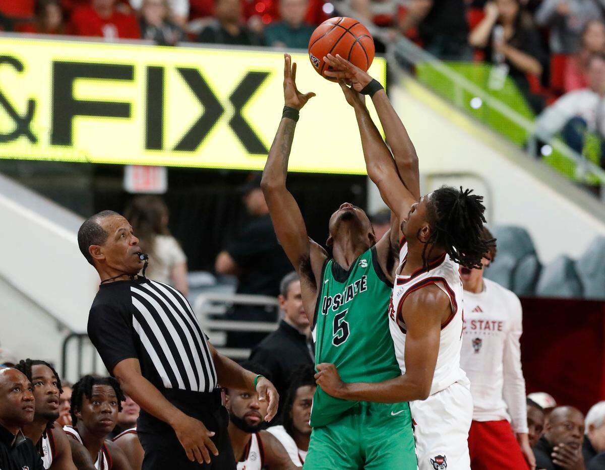 N.C. State’s Bryce Heard pressures USC Upstate’s Mister Dean during the first half of the Wolfpack’s game on Monday, Nov. 4, 2024, at the Lenovo Center in Raleigh, N.C.