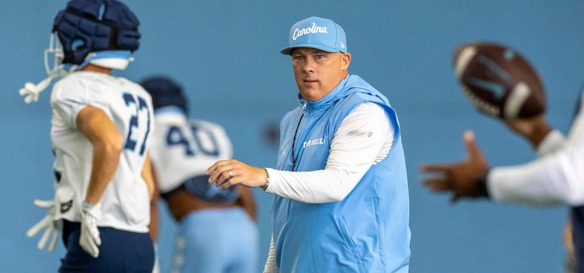 North Carolina defensive coordinator Geoff Collins works with his players during practice on Tuesday, August 6, 2024 in Chapel Hill, N.C.