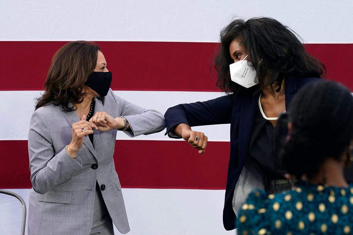 Democratic vice presidential candidate Sen. Kamala Harris, D-Calif., left, greets moderator La’Meshia Whittington-Kaminski, Deputy Director, Advance Carolina during a roundtable discussion during a campaign visit in Raleigh, N.C., Monday, Sept. 28, 2020.