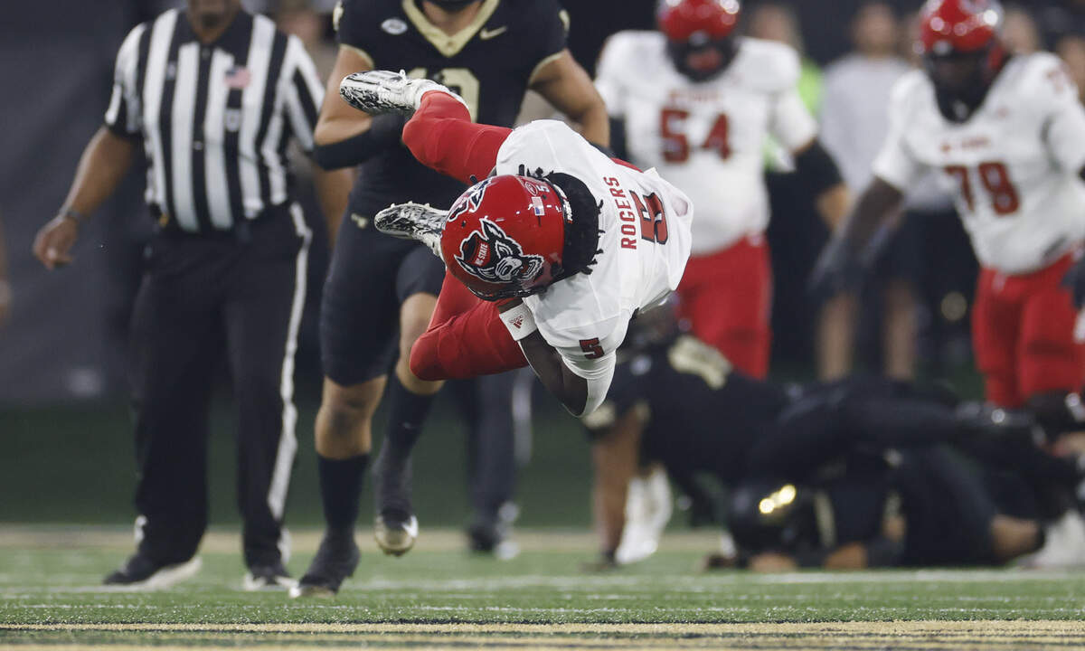 N.C. State wide receiver Noah Rogers (5) gets tripped up after making a reception during the first half of N.C. State’s game against Wake Forest at Allegacy Stadium in Winston-Salem, N.C., Thursday, Sept. 11, 2025.
