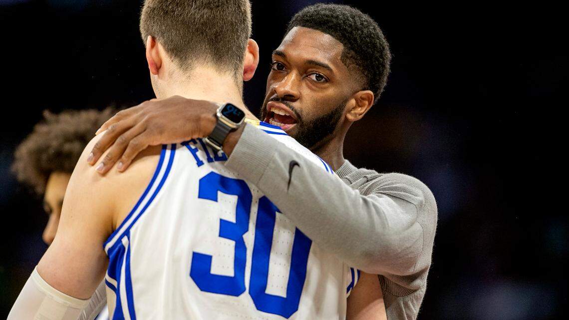 Duke assistant coach Amile Jefferson embraces Kyle Filipowski (30) prior to the Blue Devils’ game against Oral Roberts during the first round of the NCAA Tournament on Thursday, March 16, 2023 at the Amway Center in Orlando, Fla.