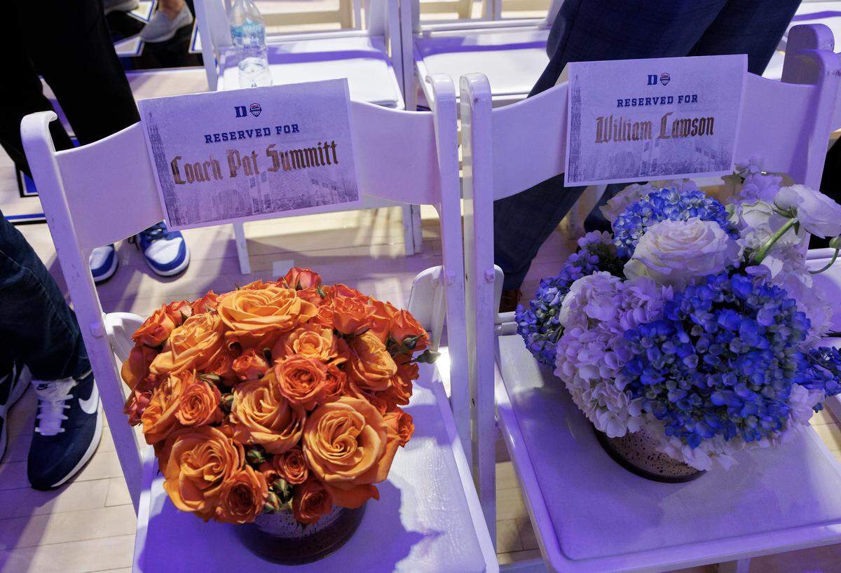 Flowers sit in chairs prior to a ceremony recognizing Kara Lawson as the 2025-2028 USA Basketball Women’s National Team head coach at Cameron Indoor Stadium on Tuesday, Sept. 23, 2025, in Durham, N.C.