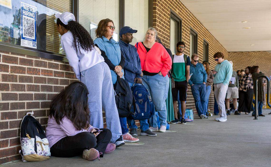 More than 40 people wait in line at the North Carolina DMV Driver’s License Office on Avent Ferry Road on Wednesday afternoon, April 10, 2025 in Raleigh, N.C. Most arrived well before 9 a.m. seeking a spot in the “first come, first served” line. Many said they had been in line multiple days seeking service, since online appointments are booked well into the months ahead.