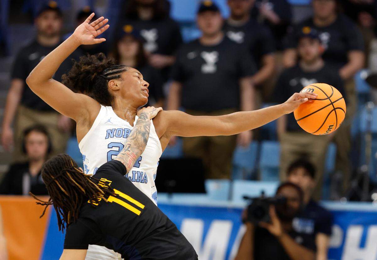 North Carolina’s Indya Nivar (24) steals the ball from West Virginia’s JJ Quinerly (11) during the second half of UNC’s 58-47 victory over West Virginia in the second round of the NCAA women’s basketball tournament at Carmichael Arena in Chapel Hill, N.C., Monday, March 24, 2025.