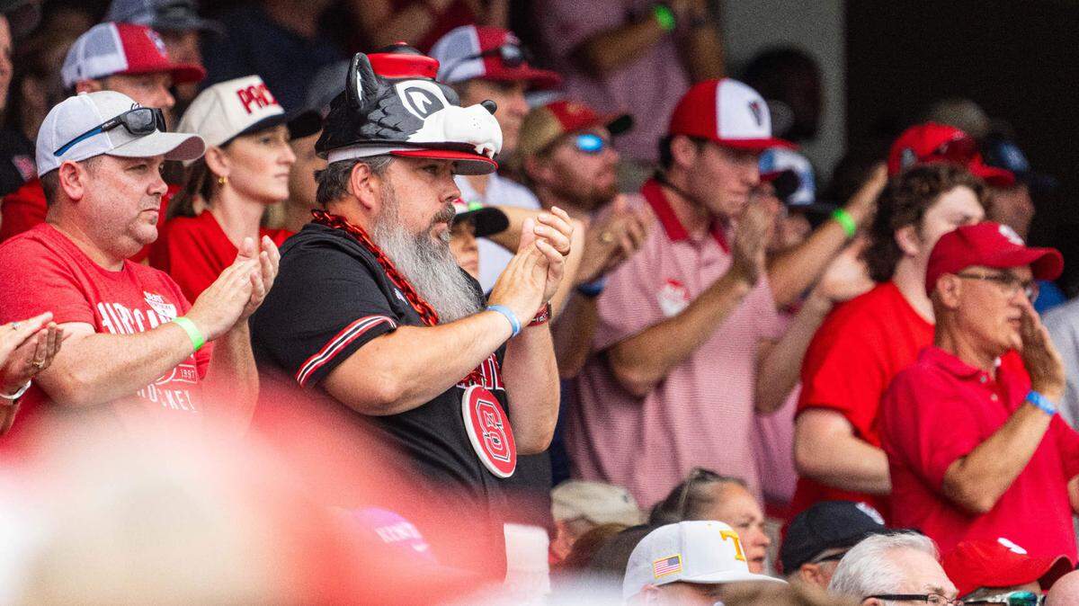 NC State Wolfpack fans cheer during the ninth inning against the Kentucky Wildcats at Charles Schwab Filed Omaha.